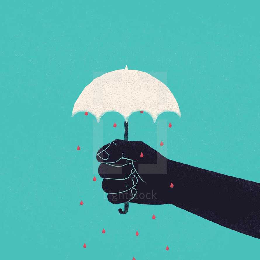 Hand holding an umbrella.