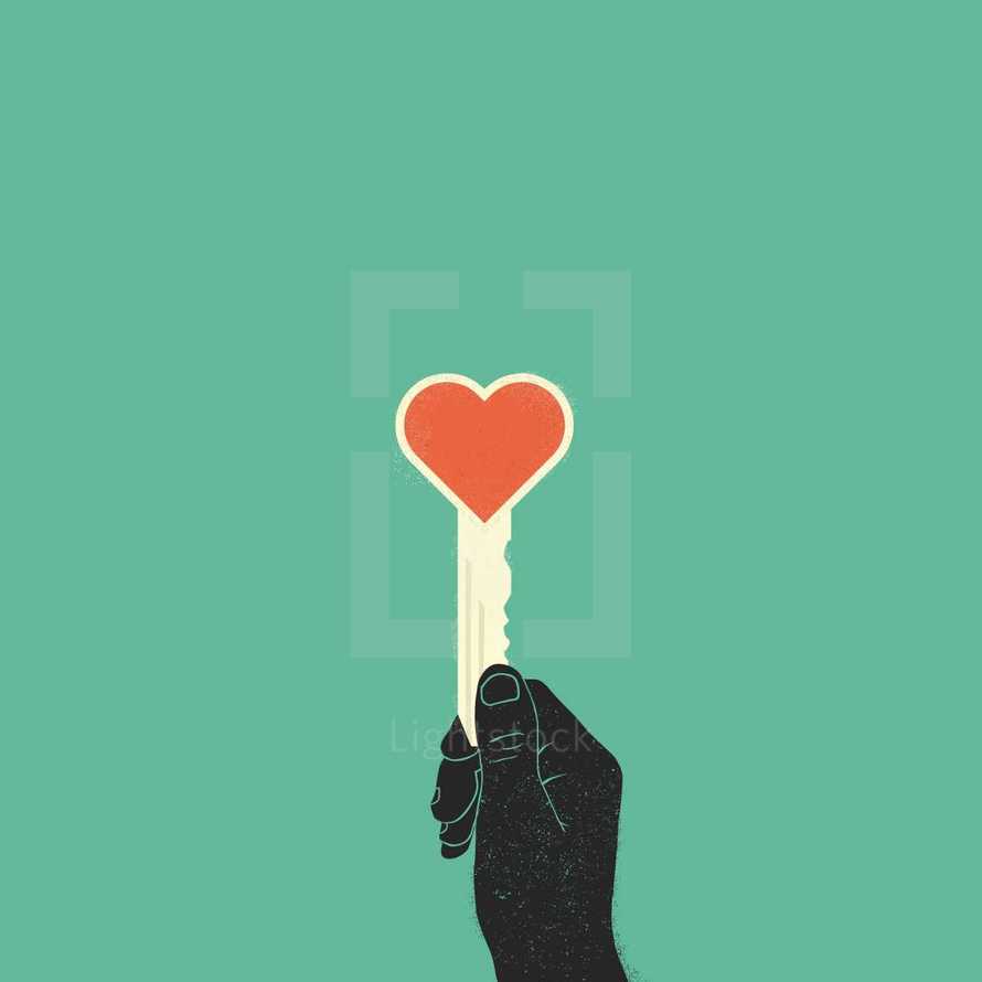 hand holding up a heart shaped key