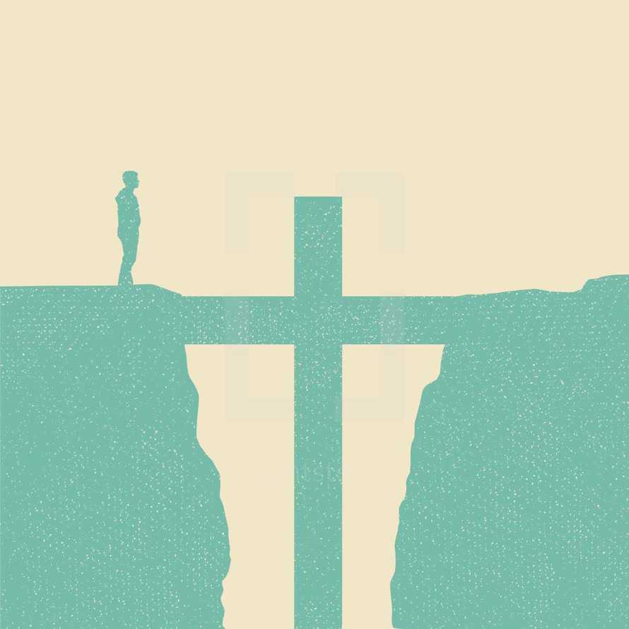 man standing on a cliff and a cross in the gap 