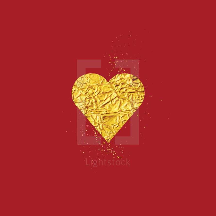 gold foil heart on red 