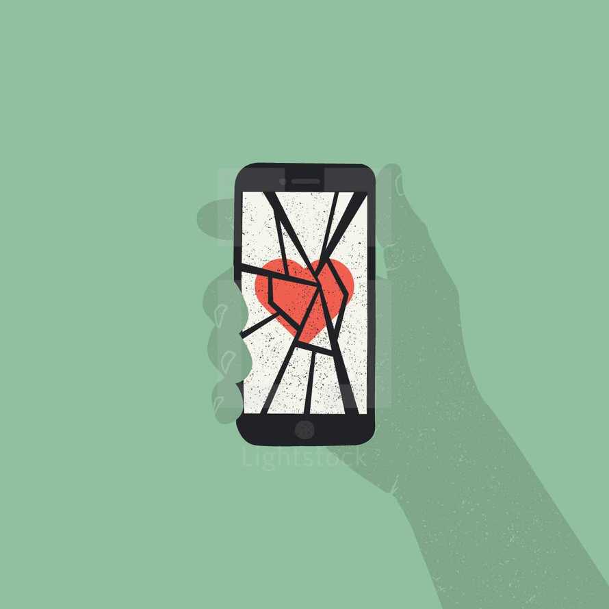 broken cellphone screen with a heart 