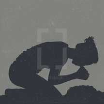 woman kneeling in prayer 