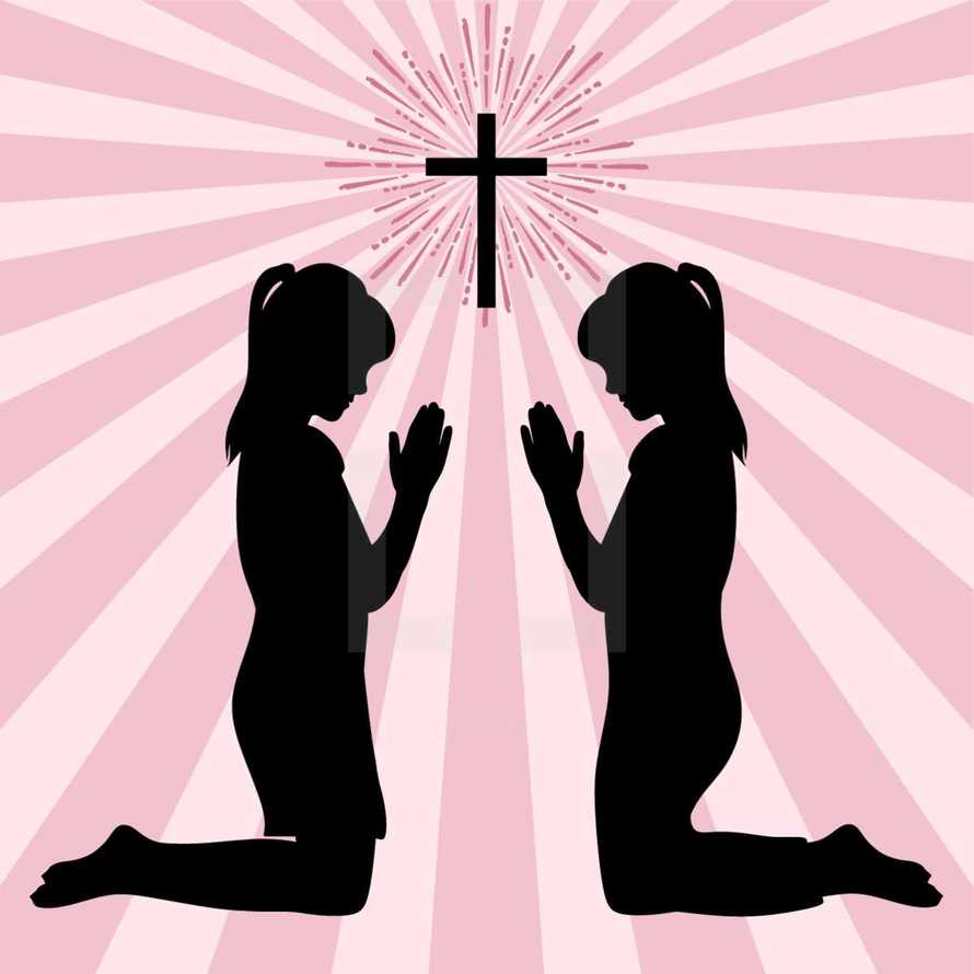 girls kneeling in prayer 