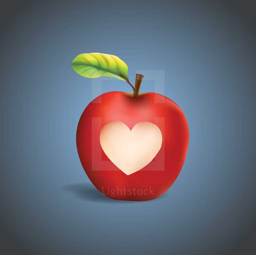 Red apple with a carved heart shape.