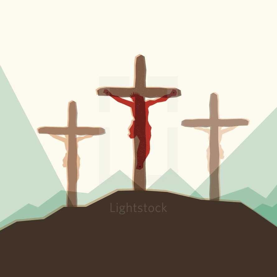 Jesus nailed to the cross on a hill. 
