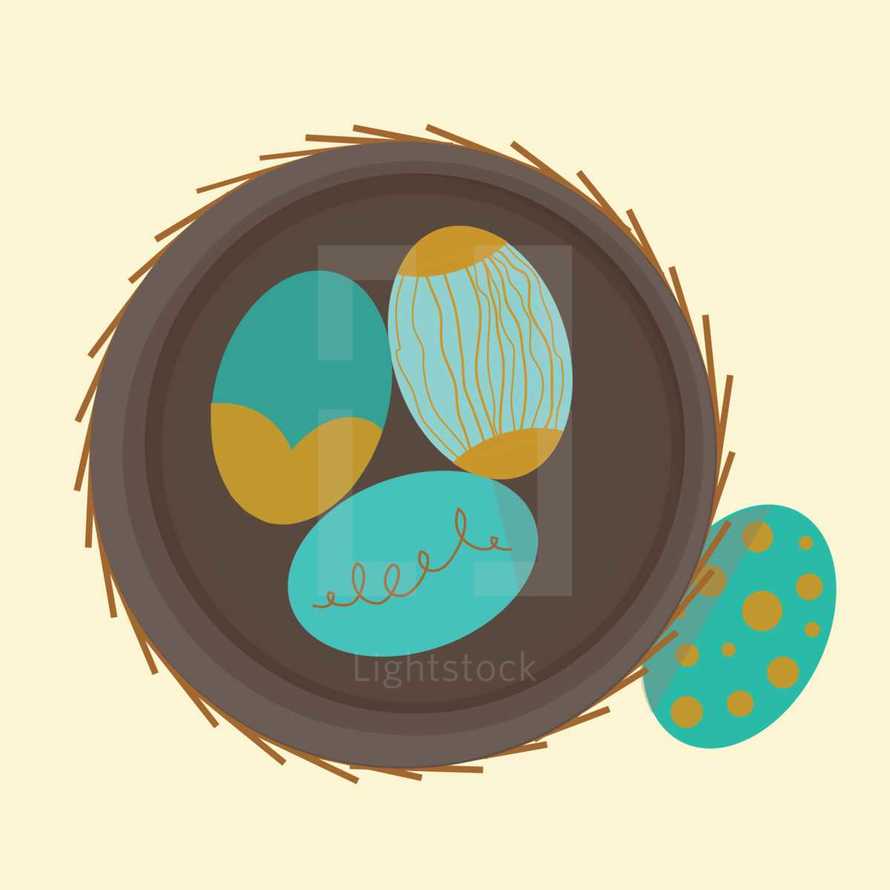 teal and gold eggs in a nest 